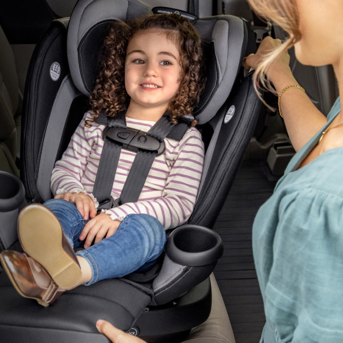 child sitting in Evenflo all-in-one car seat  