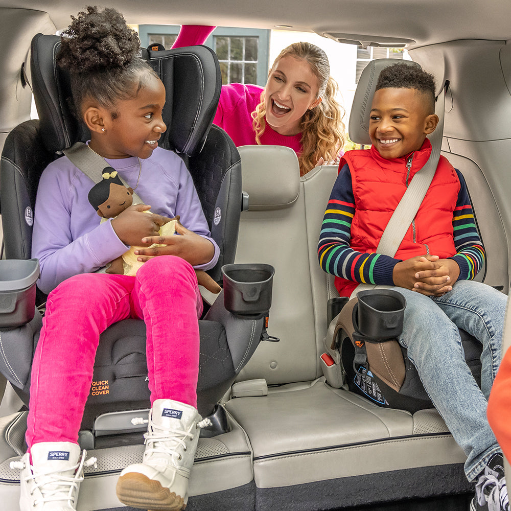 Evenflo car seat and booster seat in use in a minivan